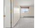 Bright bedroom with a window, a closet, and neutral carpet flooring at 2323 S Jamaica St, Aurora, CO 80014