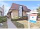 Attractive brick and siding townhome with mature landscaping, sidewalk, and 'Coming Soon' sign on a sunny day at 2323 S Jamaica St, Aurora, CO 80014