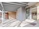 Covered patio area with sliding glass door leading into the home at 2323 S Jamaica St, Aurora, CO 80014