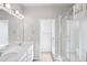 Bright bathroom with double sinks and shower enclosure at 19733 W 93Rd Ln # A, Arvada, CO 80007