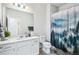 Bathroom with a shower, a large mirror, and modern fixtures at 19733 W 93Rd Ln # A, Arvada, CO 80007