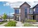 Beautiful two-story home featuring stone accents, a covered porch, and professional landscaping at 19733 W 93Rd Ln # A, Arvada, CO 80007