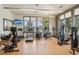 Well-equipped gym with treadmills, weights, and natural light for fitness enthusiasts at 19733 W 93Rd Ln # A, Arvada, CO 80007
