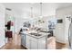 Open-concept kitchen featuring granite countertops, and stainless steel appliances at 19733 W 93Rd Ln # A, Arvada, CO 80007