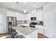 Modern kitchen with stainless steel appliances, granite countertops, and white cabinets at 19733 W 93Rd Ln # A, Arvada, CO 80007