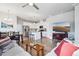 Open-concept space featuring wood floors, modern furniture, and seamlessly connecting the living area to the kitchen at 19733 W 93Rd Ln # A, Arvada, CO 80007