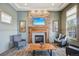 Comfortable living area with stone fireplace, TV, and ample seating at 19733 W 93Rd Ln # A, Arvada, CO 80007
