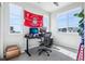 Bright home office featuring modern desk setup with views of the neighborhood at 19733 W 93Rd Ln # A, Arvada, CO 80007