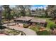 Aerial view of the home showing the roof, landscaping, and brick patio at 5503 W Colorado Ave, Lakewood, CO 80232