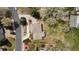 Overhead view displays the home's layout, surrounding trees, and street access at 5503 W Colorado Ave, Lakewood, CO 80232