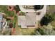 Aerial view of the home features a well-maintained roof, landscaping, and surrounding greenery at 5503 W Colorado Ave, Lakewood, CO 80232