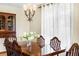 Formal dining area with dark wood table, traditional chairs, and elegant chandelier at 5503 W Colorado Ave, Lakewood, CO 80232