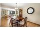 Elegant dining room connected to living spaces with a decorative chandelier and hardwood floors at 5503 W Colorado Ave, Lakewood, CO 80232