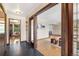 The foyer features slate tile flooring and leads into a living space with wood parquet flooring at 5503 W Colorado Ave, Lakewood, CO 80232