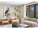 Cozy living area featuring neutral colors, stylish seating, and large window views at 5503 W Colorado Ave, Lakewood, CO 80232