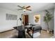 Well-lit office featuring a modern desk, contemporary decor, and a ceiling fan for added comfort at 5503 W Colorado Ave, Lakewood, CO 80232