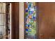 Stained glass accent window located near the front door adds natural light and character to the entryway at 5503 W Colorado Ave, Lakewood, CO 80232