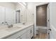 Bright bathroom featuring a double vanity with white cabinets and quartz countertop plus a tub and shower combination at 1440 Eversole Dr, Broomfield, CO 80023