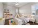 Cozy bedroom with a small bed, a play tent and a white storage unit with toys at 1440 Eversole Dr, Broomfield, CO 80023