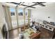 Overhead view of a well-lit living room, dining room, and kitchen area with luxurious finishes at 1440 Eversole Dr, Broomfield, CO 80023