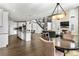 Bright and airy living room with a chandelier, a fireplace, and an open-concept design at 1440 Eversole Dr, Broomfield, CO 80023