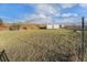 The large backyard features a trailer and storage containers on the grounds at 7892 Beverly Blvd, Castle Pines, CO 80108