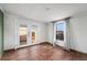 Bright bedroom features neutral walls, double doors to the backyard and a large window at 7892 Beverly Blvd, Castle Pines, CO 80108