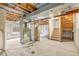 Unfinished basement with exposed ductwork and stairs to the upper level at 1261 E 135Th Pl, Thornton, CO 80241