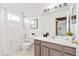 Cozy white bathroom featuring tub, shower and modern vanity at 1261 E 135Th Pl, Thornton, CO 80241