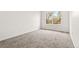 Bright bedroom with large window and plush neutral carpeting at 1261 E 135Th Pl, Thornton, CO 80241