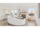 Cozy living room featuring a fireplace, built-in shelves, and stylish furnishings at 1261 E 135Th Pl, Thornton, CO 80241