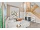 Inviting living area with high ceilings, a large window, and stylish decor elements at 1261 E 135Th Pl, Thornton, CO 80241