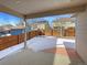 Covered patio overlooking a fenced backyard with a shed at 445 Tumbleweed Dr, Brighton, CO 80601