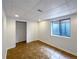 Finished basement room featuring tile floors and ample closet space at 445 Tumbleweed Dr, Brighton, CO 80601