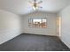 Bright bedroom with neutral carpeting and ample natural light at 445 Tumbleweed Dr, Brighton, CO 80601