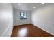 Bright bedroom with hardwood floors and window at 445 Tumbleweed Dr, Brighton, CO 80601
