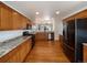 Kitchen with wood cabinets, granite countertops, and stainless steel appliances at 445 Tumbleweed Dr, Brighton, CO 80601