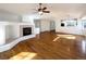 Spacious living room featuring hardwood floors and a fireplace at 445 Tumbleweed Dr, Brighton, CO 80601