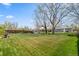 Spacious back yard with a picnic table, shed, tall wooden fence, and a lush green lawn at 8012 Zuni St, Denver, CO 80221