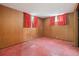 Unfinished basement with red tile flooring and small windows at 8012 Zuni St, Denver, CO 80221