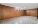 Basement featuring paneled walls and tile floors at 8012 Zuni St, Denver, CO 80221