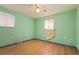 Bedroom with hardwood floors, and a window at 8012 Zuni St, Denver, CO 80221