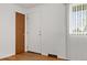The home's light-filled entryway features a window and closet for storage at 8012 Zuni St, Denver, CO 80221