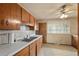 Kitchen with wood cabinets and laminate countertops at 8012 Zuni St, Denver, CO 80221