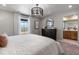 Bedroom with a window that provides natural light, dark-wood dresser, carpeted floors, and stylish decorations at 2086 Wagon Wheel Aly, Brighton, CO 80601