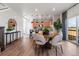 Open-concept dining area featuring a modern table and stylish decor at 2086 Wagon Wheel Aly, Brighton, CO 80601