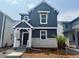 Charming two-story home with a modern exterior and stone accents, complemented by a neatly landscaped front yard at 2086 Wagon Wheel Aly, Brighton, CO 80601