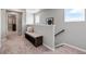 Hallway featuring a bench with storage and windows that provide natural light at 2086 Wagon Wheel Aly, Brighton, CO 80601