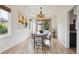 Stylish dining room with modern lighting, neutral decor, and large windows offering a relaxing space at 2240 Summitview Dr, Longmont, CO 80504
