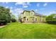 Beautifully landscaped backyard featuring a well-maintained lawn and verdant trees at 2240 Summitview Dr, Longmont, CO 80504
